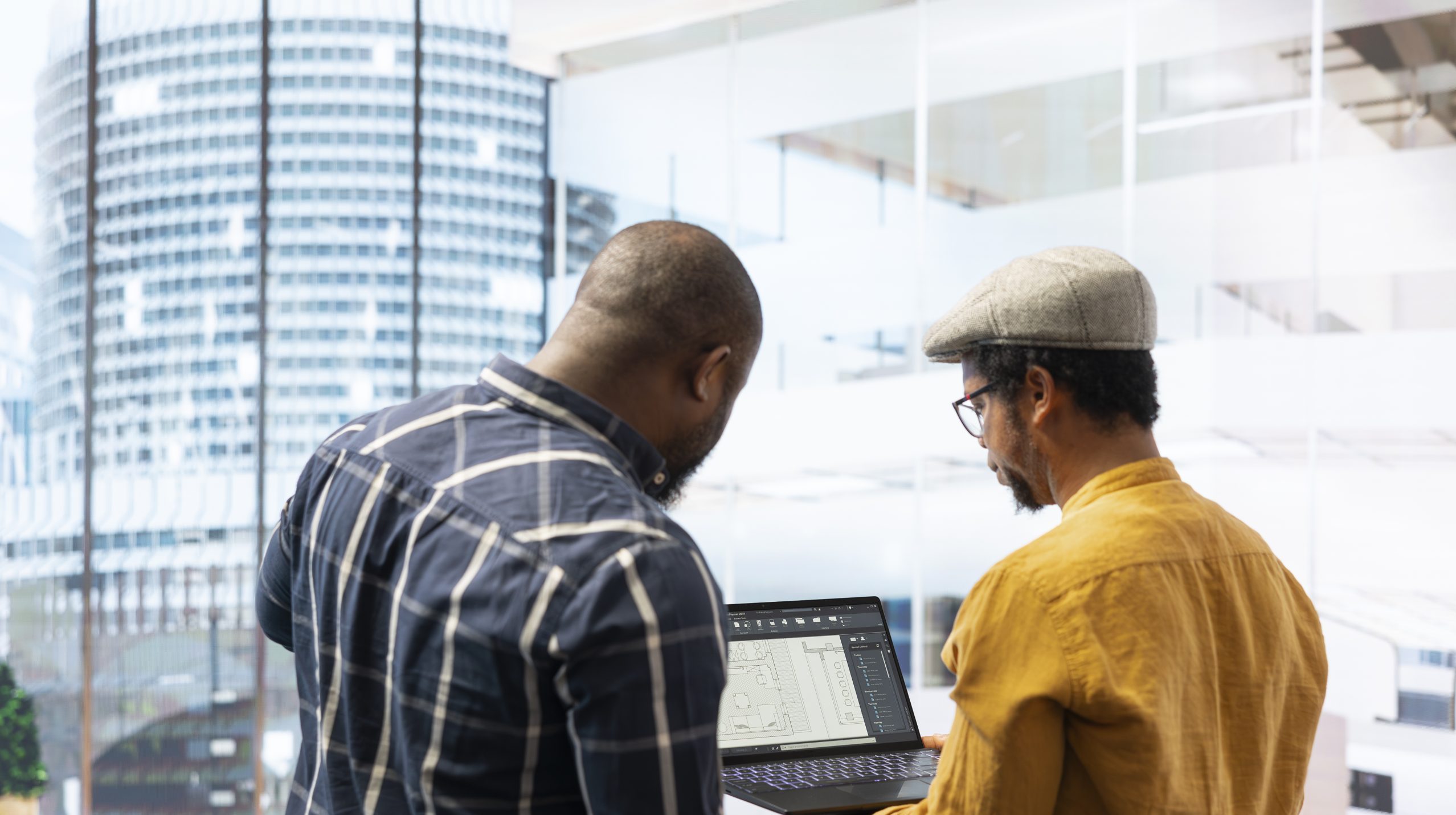 Real estate investment expert and entrepreneur planning an office space relocation, examining blueprints and discussing the layout for the new workspace. Looking to buy urban property.